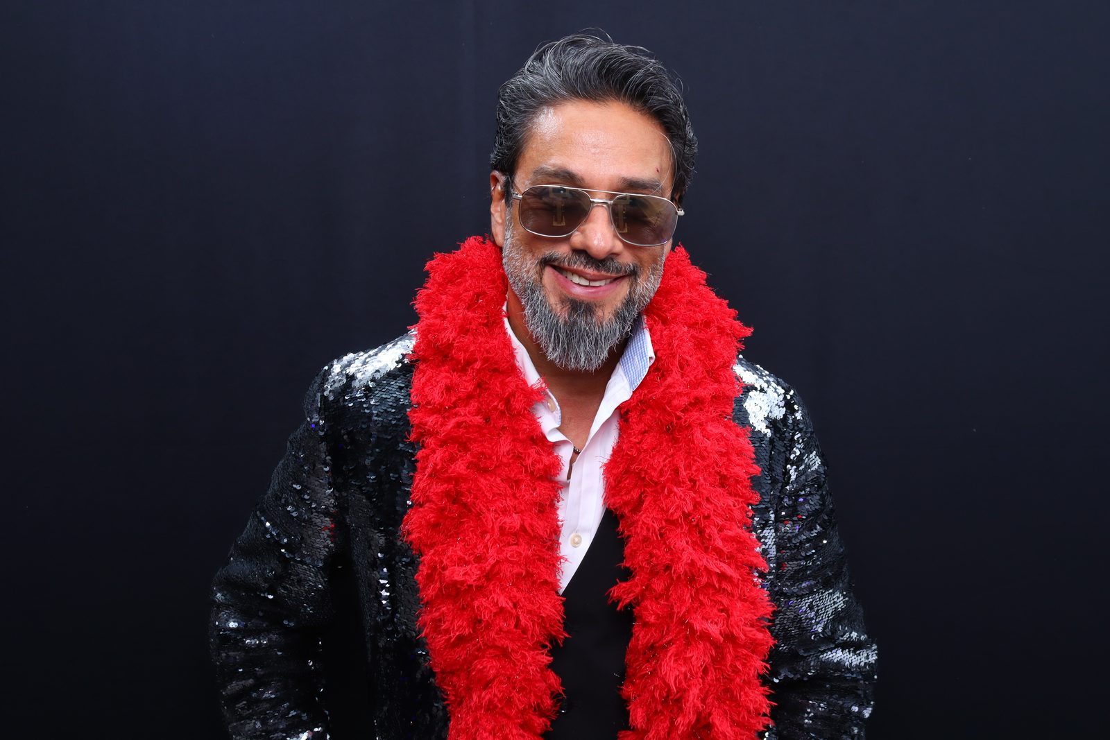 Dramatic studio-style portrait against a black backdrop at the bar mitzvah photo booth